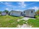 Backyard showcases the home, trailer parking, and a storage shed at 997 28Th Avenue E Dr, Bradenton, FL 34208