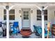 Cozy front porch featuring a comfortable seating area and decorative lighting, perfect for enjoying the outdoors at 997 28Th Avenue E Dr, Bradenton, FL 34208