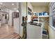 Bright laundry room area with storage and stainless steel appliances at 997 28Th Avenue E Dr, Bradenton, FL 34208