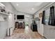 Inviting living room showcasing a television and a view of the exterior at 997 28Th Avenue E Dr, Bradenton, FL 34208