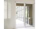 Bright room with large sliding glass doors leading to a screened lanai, inviting indoor-outdoor living at 104 Park Trace Blvd, Osprey, FL 34229