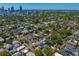 A wide aerial perspective showcases the property amid the beautiful cityscape, balancing urban living with lush surroundings at 1140 Oak Ne St, St Petersburg, FL 33701