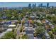 A high-angle view of the property shows its proximity to downtown skyscrapers and lush greenery, offering urban accessibility at 1140 Oak Ne St, St Petersburg, FL 33701