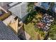 Aerial view of landscaped backyard with seating, patio, lawn, and privacy fence at 1140 Oak Ne St, St Petersburg, FL 33701