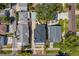 Directly above, the neighborhood blends tightly-knit homes with a central patio space shaded by an old tree at 1140 Oak Ne St, St Petersburg, FL 33701