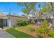 Lush backyard with a beautiful brick patio, landscaped garden, and privacy fence at 1140 Oak Ne St, St Petersburg, FL 33701