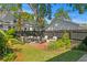 Beautiful backyard with patio, fire pit, seating area, and lush greenery at 1140 Oak Ne St, St Petersburg, FL 33701