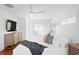 Beautiful bright white bedroom featuring hardwood floors and a ceiling fan at 1140 Oak Ne St, St Petersburg, FL 33701