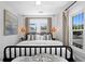 Modern bedroom with large windows, stylish lighting, and comfortable bedding at 1140 Oak Ne St, St Petersburg, FL 33701