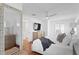 Bright bedroom with hard wood floors, ceiling fan and large mirror at 1140 Oak Ne St, St Petersburg, FL 33701