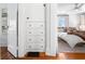 Bedroom with attached storage and bed with patterned pillows and throws at 1140 Oak Ne St, St Petersburg, FL 33701