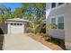 Long driveway leads to a detached garage with a well-maintained yard at 1140 Oak Ne St, St Petersburg, FL 33701