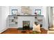 Close up of a fireplace in the living room featuring custom decor, shelving and a unique design at 1140 Oak Ne St, St Petersburg, FL 33701