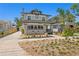 Charming two-story home with a well-manicured front yard and inviting entrance, perfect for Gathering living at 1140 Oak Ne St, St Petersburg, FL 33701