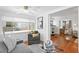 Inviting living room with hardwood floors, a plush gray sofa, and lots of natural light at 1140 Oak Ne St, St Petersburg, FL 33701