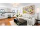 Inviting living room with hardwood floors, a fireplace, built-in shelving, and stylish decor at 1140 Oak Ne St, St Petersburg, FL 33701