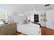 Bright main bedroom features hardwood floors, plantation shutters, ceiling fan, and a neutral color palette at 1140 Oak Ne St, St Petersburg, FL 33701