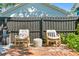 Cozy patio with brick flooring, comfortable seating, and privacy fence at 1140 Oak Ne St, St Petersburg, FL 33701