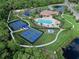 Aerial view of community featuring pool, pickleball courts, and clubhouse at 11924 Persian Ter, Bradenton, FL 34212