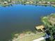 Scenic aerial view of community lake with fishing pier and walking path at 11924 Persian Ter, Bradenton, FL 34212
