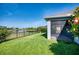 Beautiful backyard with green lawn and screened patio overlooking a lovely pond at 11924 Persian Ter, Bradenton, FL 34212