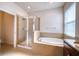Bathroom features a soaking tub, walk-in shower, and tiled floors at 11924 Persian Ter, Bradenton, FL 34212