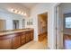 Bathroom featuring double vanity and a door leading to a walk-in closet at 11924 Persian Ter, Bradenton, FL 34212