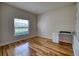Bright bedroom features wood flooring, window with blinds, and built-in desk at 11924 Persian Ter, Bradenton, FL 34212