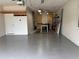 Well-lit garage with epoxy floor, ample storage cabinets, and extra work area at 11924 Persian Ter, Bradenton, FL 34212