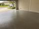Spacious two-car garage features a professionally coated floor and block wall construction at 11924 Persian Ter, Bradenton, FL 34212