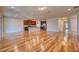 Open-concept living room and kitchen with hardwood floors and modern stainless appliances at 11924 Persian Ter, Bradenton, FL 34212