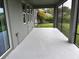 Relaxing screened patio perfect for outdoor entertaining, featuring new flooring and backyard views at 11924 Persian Ter, Bradenton, FL 34212