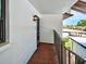 Condo balcony featuring an outdoor light, carpeted flooring and views of the community at 1211 Capri Isles Blvd # 26, Venice, FL 34292