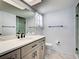 Nicely appointed bathroom features modern vanity with hardware, quartz countertop, and glass shower at 1211 Capri Isles Blvd # 26, Venice, FL 34292