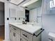 Updated bathroom features a modern vanity with sleek hardware, quartz countertop, and ample lighting at 1211 Capri Isles Blvd # 26, Venice, FL 34292