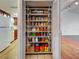 Large walk-in pantry with organized shelving and ample storage space at 1211 Capri Isles Blvd # 26, Venice, FL 34292