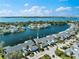 Breathtaking aerial view of a waterfront community boasting manicured lawns and serene water views at 1211 Spoonbill Landings Cir, Bradenton, FL 34209