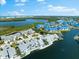 Panoramic aerial view of a waterfront community, showcasing beautiful homes, lush landscaping, and tranquil water features at 1211 Spoonbill Landings Cir, Bradenton, FL 34209