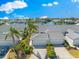 Stunning aerial view of a well-maintained home with a three-car garage and lush landscaping at 1211 Spoonbill Landings Cir, Bradenton, FL 34209