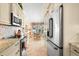 View of kitchen and dining area with modern appliances and granite countertops at 1211 Spoonbill Landings Cir, Bradenton, FL 34209