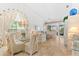 Bright and airy living area featuring a dining space and comfortable seating with large windows at 1211 Spoonbill Landings Cir, Bradenton, FL 34209