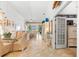 Spacious living area with elegant furnishings, dining table, and sliding doors to the outdoors at 1211 Spoonbill Landings Cir, Bradenton, FL 34209