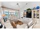 Bright living room with comfortable seating, entertainment center, and scenic outdoor views at 1211 Spoonbill Landings Cir, Bradenton, FL 34209