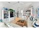 Spacious living room with neutral tones, shelving, and glimpses of the dining area at 1211 Spoonbill Landings Cir, Bradenton, FL 34209
