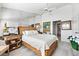Large main bedroom with decor, a ceiling fan, and a door to the bathroom at 1211 Spoonbill Landings Cir, Bradenton, FL 34209