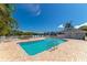 Inviting community pool with a sun deck, a hot tub, and lush landscaping, perfect for relaxation and recreation at 1211 Spoonbill Landings Cir, Bradenton, FL 34209