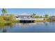 Scenic waterfront deck with seating, beautiful pond views, and access to community amenities at 1211 Spoonbill Landings Cir, Bradenton, FL 34209