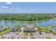 Community amenities boast a beautiful lakefront pool, clubhouse, and ample parking at 13013 Oak Hill Way, Parrish, FL 34219