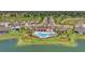 The community pool and surrounding homes feature a community clubhouse and beautiful lake at 13013 Oak Hill Way, Parrish, FL 34219