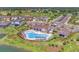 Aerial view showcasing the community pool, clubhouse, and surrounding residences at 13013 Oak Hill Way, Parrish, FL 34219